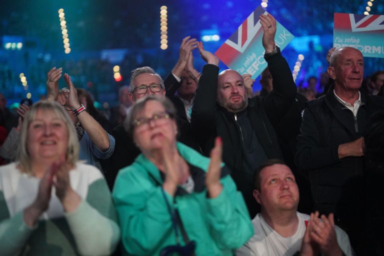 Attendees applaud after a speech by Reform UK leader Nigel Farage during the Reform UK local election launch rally at the Utilita Arena Birmingham, in Birmingham. Picture date: Friday March 28, 2025.